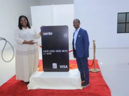 Corine Mbiaketcha Nana - Visa Vice President and General Manager, East Africa poses for the Xente Visa Card with Allan Rwakatungu, CEO & Founder of Xente Tech Ltd