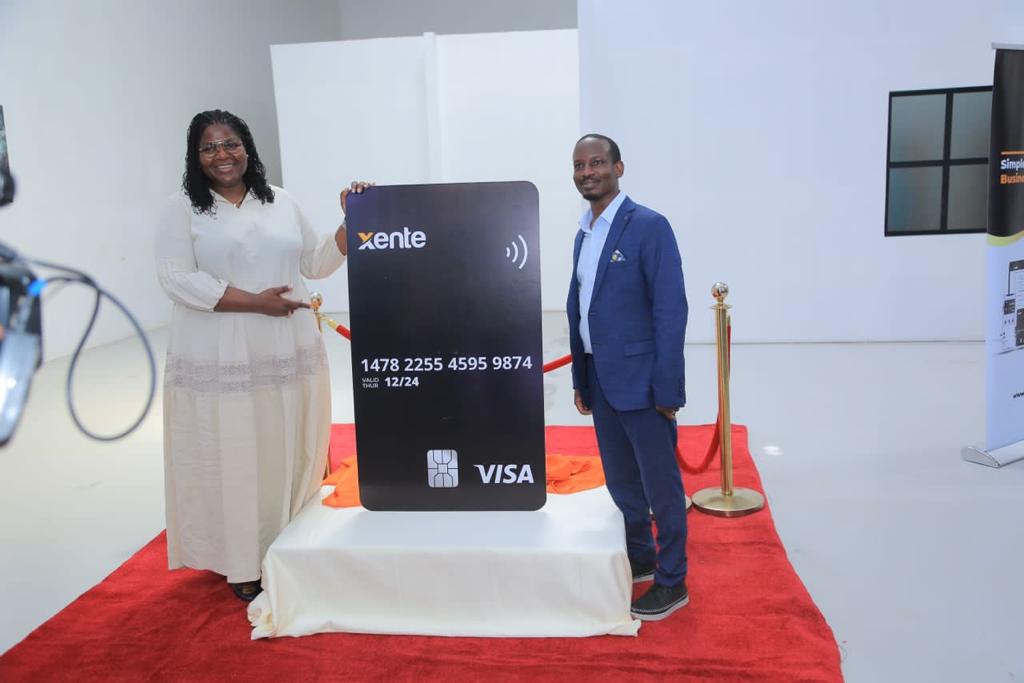 Corine Mbiaketcha Nana - Visa Vice President and General Manager, East Africa poses for the Xente Visa Card with Allan Rwakatungu, CEO & Founder of Xente Tech Ltd